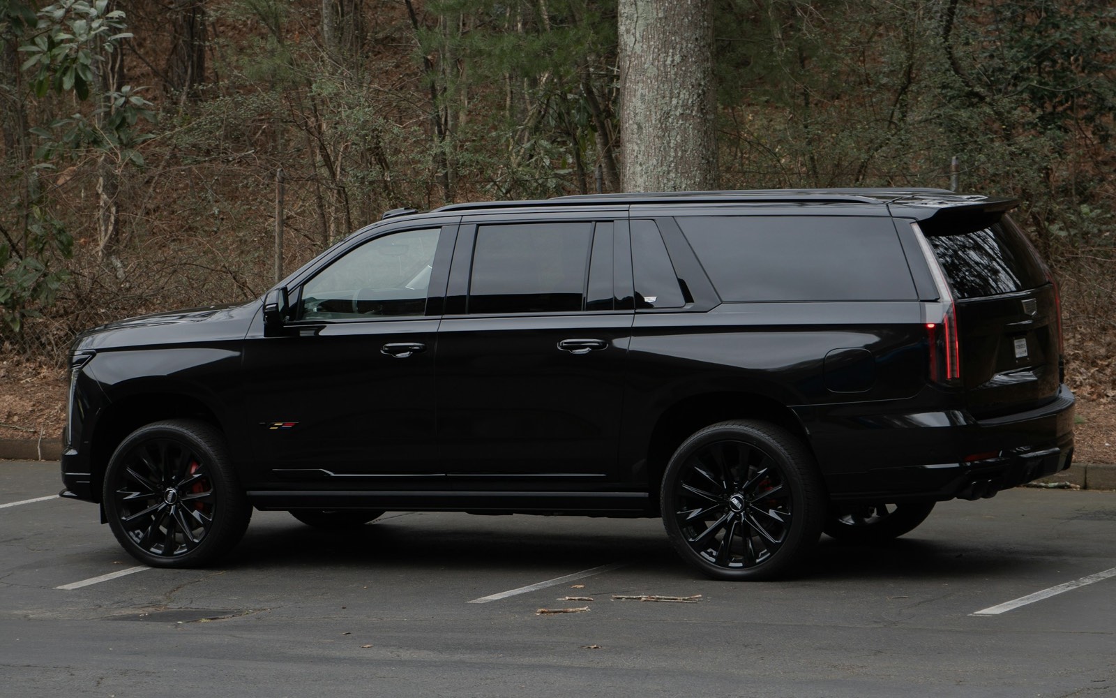 Side view of a black full-size luxury SUV