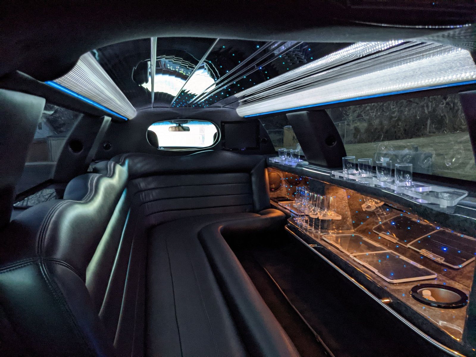 LED-lit luxury vehicle interior with lounge seating for a group night out